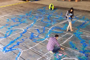 People working on the Know Your Ravines mural.