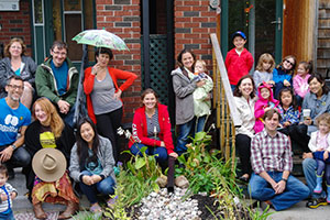 Danforth East Village residents gathered around the rain garden.
